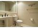 Small bathroom with pedestal sink and toilet at 2646 E Spring Rd, Phoenix, AZ 85032