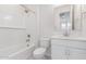 Bathroom showcasing a shower-tub, vanity with sink, and tile flooring at 2917 N Evergreen St, Buckeye, AZ 85396