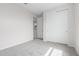 Bedroom featuring neutral walls, soft carpeting, and a closet with sliding doors at 2917 N Evergreen St, Buckeye, AZ 85396