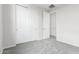 Bedroom with neutral walls, soft carpeting and a closet with sliding doors at 2917 N Evergreen St, Buckeye, AZ 85396