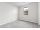 Bedroom showcasing neutral walls, soft carpeting and a window providing natural light at 2917 N Evergreen St, Buckeye, AZ 85396