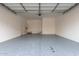 Spacious garage with an epoxy floor and automatic door at 2917 N Evergreen St, Buckeye, AZ 85396