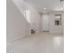 Bright living area with tile floors, recessed lighting, staircase and white front door at 2917 N Evergreen St, Buckeye, AZ 85396