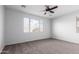 Spacious bedroom with large window and ceiling fan at 3670 E Janelle Way, Gilbert, AZ 85298