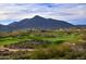 Luxury homes and scenic golf course with mountain backdrop at 38300 N 102Nd St, Scottsdale, AZ 85262