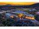 Luxury home with modern architecture, golf course views, and sunset at 38300 N 102Nd St, Scottsdale, AZ 85262