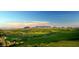 Vast golf course with rolling greens and distant mountains at 38300 N 102Nd St, Scottsdale, AZ 85262