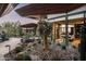 Landscaped backyard oasis with native plants and a water feature at 38300 N 102Nd St, Scottsdale, AZ 85262