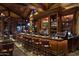 Rustic bar with rich wood finishes and golf course views at 38300 N 102Nd St, Scottsdale, AZ 85262