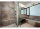 Spa-like bathroom with a large soaking tub and walk-in shower at 38300 N 102Nd St, Scottsdale, AZ 85262
