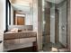 Modern bathroom with concrete sink and glass shower at 38300 N 102Nd St, Scottsdale, AZ 85262