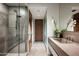 Spa-like bathroom with a large walk-in shower and concrete vanity at 38300 N 102Nd St, Scottsdale, AZ 85262