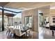 Elegant dining area with a large table and modern light fixtures at 38300 N 102Nd St, Scottsdale, AZ 85262