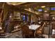 Elegant dining room with stone fireplace and upscale decor at 38300 N 102Nd St, Scottsdale, AZ 85262