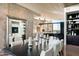 Contemporary dining room features a long table and built-in shelving at 38300 N 102Nd St, Scottsdale, AZ 85262