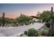 Landscaped driveway leading to a modern home at 38300 N 102Nd St, Scottsdale, AZ 85262