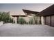 Brick driveway leading to a modern home with two garages at 38300 N 102Nd St, Scottsdale, AZ 85262