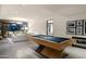 Light and bright game room with pool table and attached living space at 38300 N 102Nd St, Scottsdale, AZ 85262