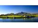 Golf course with a lake and mountain backdrop at 38300 N 102Nd St, Scottsdale, AZ 85262