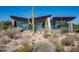 Modern desert home with unique roofline and large windows at 38300 N 102Nd St, Scottsdale, AZ 85262