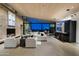 Expansive living room with a fireplace, comfortable seating, and seamless indoor-outdoor flow at 38300 N 102Nd St, Scottsdale, AZ 85262