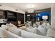 Elegant living area featuring fireplace, TV, and designer furniture at 38300 N 102Nd St, Scottsdale, AZ 85262