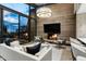 Bright living room featuring a fireplace, comfortable seating, and serene views at 38300 N 102Nd St, Scottsdale, AZ 85262