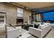 Open living room featuring a fireplace, neutral tones and comfortable white sofas at 38300 N 102Nd St, Scottsdale, AZ 85262