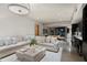 Spacious living room featuring designer furniture and wet bar at 38300 N 102Nd St, Scottsdale, AZ 85262