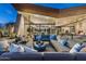 Spacious patio with comfortable seating, desert landscaping, pool and stunning architectural design at 38300 N 102Nd St, Scottsdale, AZ 85262