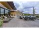 Expansive outdoor patio with multiple lounge areas offering panoramic views, perfect for relaxation and entertaining guests at 38300 N 102Nd St, Scottsdale, AZ 85262