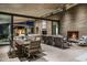 Expansive patio with outdoor seating and dining with fireplace and architectural home design at 38300 N 102Nd St, Scottsdale, AZ 85262