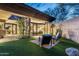 Inviting outdoor patio with lounge chairs, desert landscaping, and stylish design at 38300 N 102Nd St, Scottsdale, AZ 85262