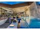 Backyard pool, with an outdoor kitchen, stone steps and stunning architectural design at 38300 N 102Nd St, Scottsdale, AZ 85262