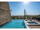 Luxury pool and spa with a waterfall feature and mountain views at 38300 N 102Nd St, Scottsdale, AZ 85262