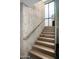Modern concrete staircase with glass and metal accents at 38300 N 102Nd St, Scottsdale, AZ 85262