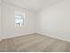 Bright bedroom featuring a window and neutral carpet at 4041 S 176Th Dr, Goodyear, AZ 85338