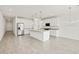 Open-concept kitchen with island, stainless steel appliances, and stylish pendant lighting at 4041 S 176Th Dr, Goodyear, AZ 85338
