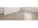 Bedroom showcasing neutral color palette and wood-look tile flooring throughout at 4822 N 177Th Ln, Goodyear, AZ 85395