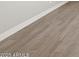 Wood-look tile flooring with white baseboards throughout the house at 4822 N 177Th Ln, Goodyear, AZ 85395