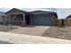 Beautiful front exterior showcasing a low maintenance desert landscape and inviting entrance at 4822 N 177Th Ln, Goodyear, AZ 85395