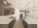 Spacious kitchen featuring a center island, stainless appliances, and dark cabinets at 4822 N 177Th Ln, Goodyear, AZ 85395