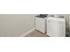 A well-equipped laundry room featuring a washer and dryer on wood-look floors at 4822 N 177Th Ln, Goodyear, AZ 85395