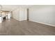 Open living space adjacent to modern kitchen with stainless appliances, and ample natural light at 4822 N 177Th Ln, Goodyear, AZ 85395