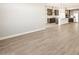 Expansive open living space leading into a kitchen with stainless steel appliances and granite countertops at 4822 N 177Th Ln, Goodyear, AZ 85395
