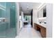 Bathroom with double vanity and view of bedroom and shower at 5455 E Lincoln Dr # 1001, Paradise Valley, AZ 85253