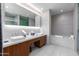 Elegant bathroom with double vanity and soaking tub at 5455 E Lincoln Dr # 1001, Paradise Valley, AZ 85253