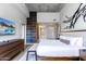 Main bedroom with king-size bed and ensuite bathroom access at 5455 E Lincoln Dr # 1001, Paradise Valley, AZ 85253