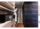 Large walk-in closet with safe and built-in shelving at 5455 E Lincoln Dr # 1001, Paradise Valley, AZ 85253