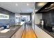 Open concept kitchen boasts stainless steel appliances and hardwood floors at 5455 E Lincoln Dr # 1001, Paradise Valley, AZ 85253